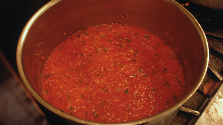 cooking tomato sauce in pot