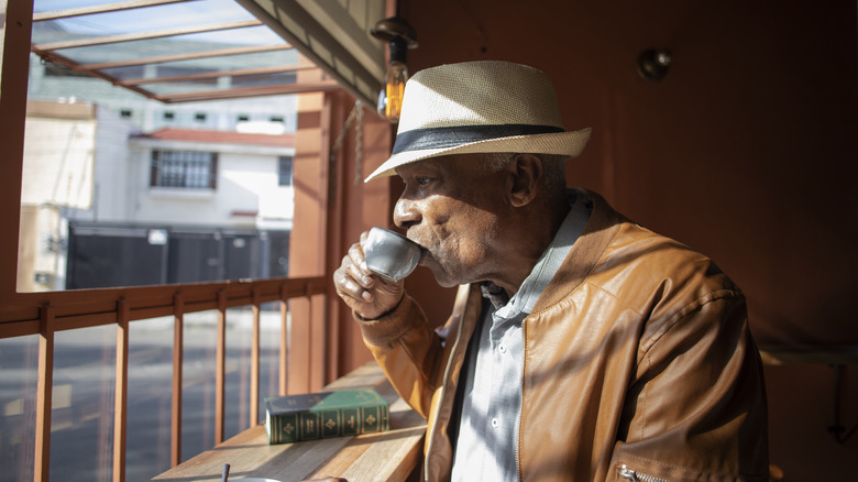 man drinking cuban coffee