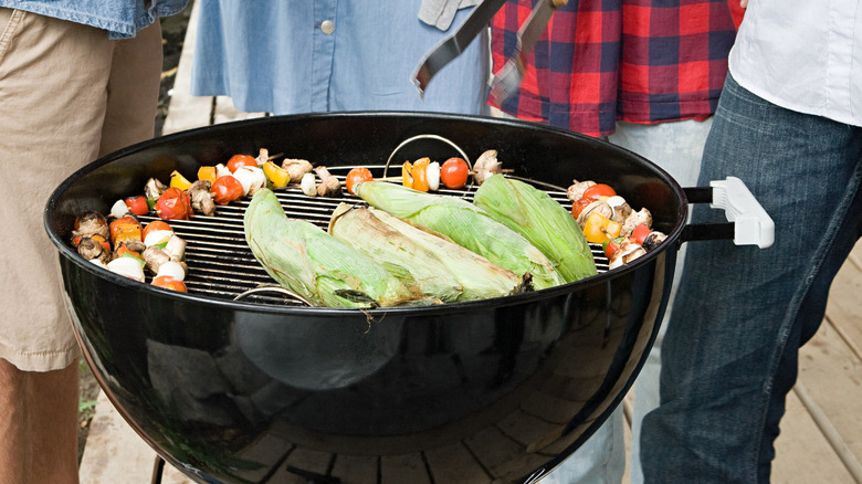 open grill with vegetables on it