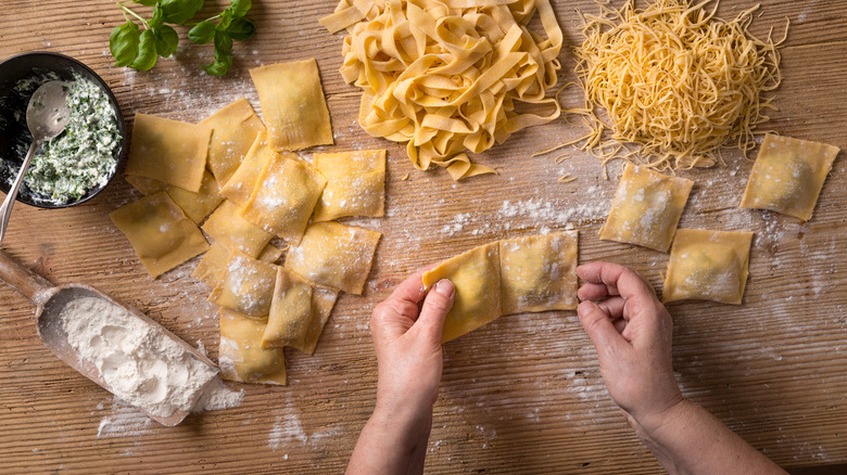 Hands making ravioli