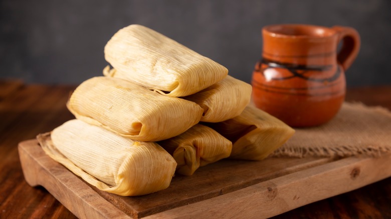 https://www.tastingtable.com/img/gallery/why-it-pays-to-use-a-masa-spreader-when-making-tamales/intro-1702921673.jpg