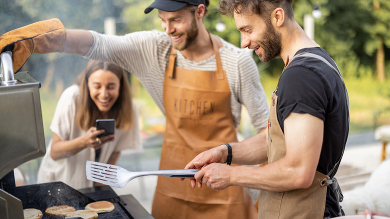 Friends grilling at a barbeque