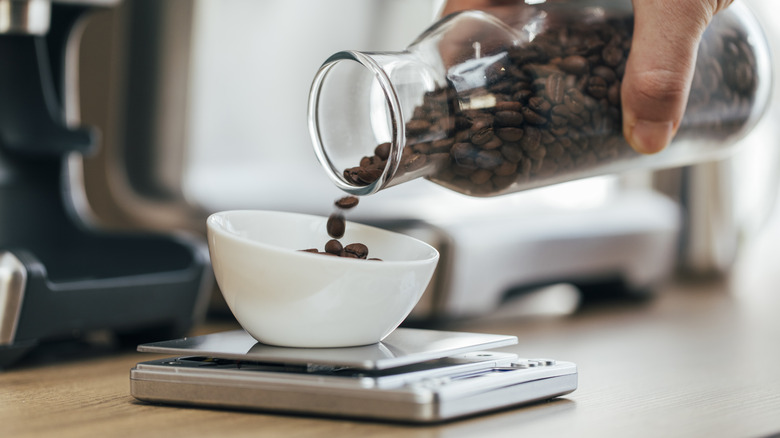 weighing coffee beans on a scale