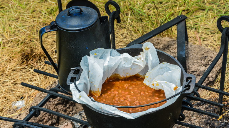 Boston baked beans cooked over a fire 