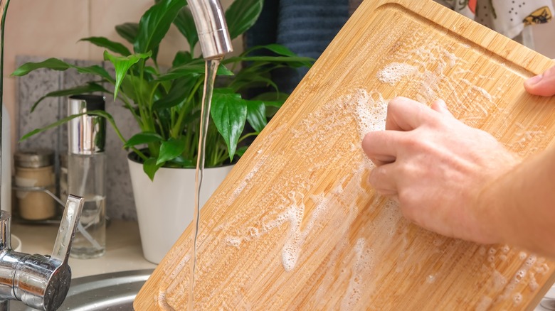 Washing cutting board with soap