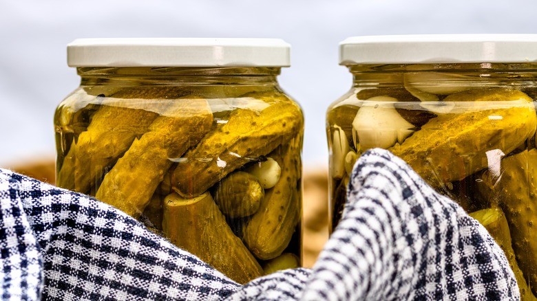 close up of pickle jars