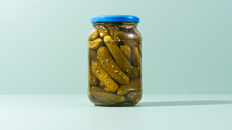 jar of pickles on neutral background