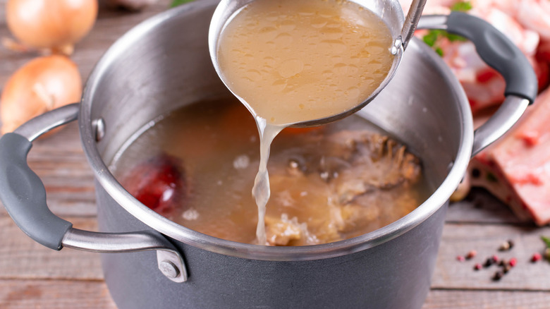 Ladle of stock from a pot