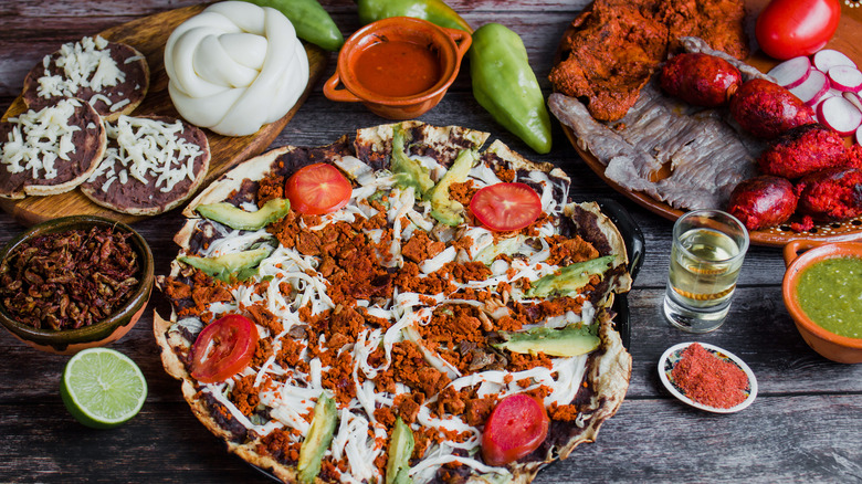 Oaxacan tlayuda on table with ingrdients