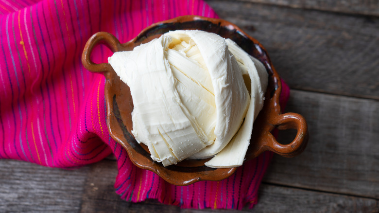 Oaxaca cheese in ceramic dish