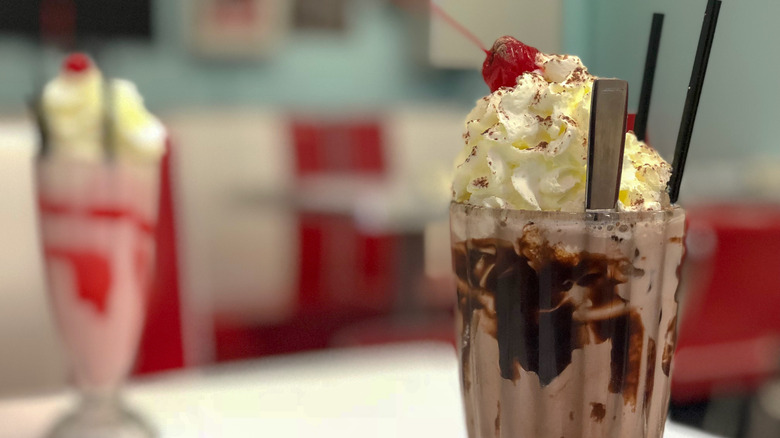 Close-up of a milkshake in a diner setting