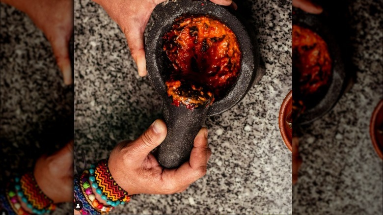 Crushing spices for mole poblano