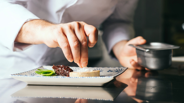 Chef plating foie gras