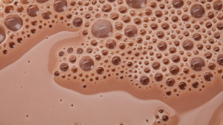 Chocolate milk bubbles close up