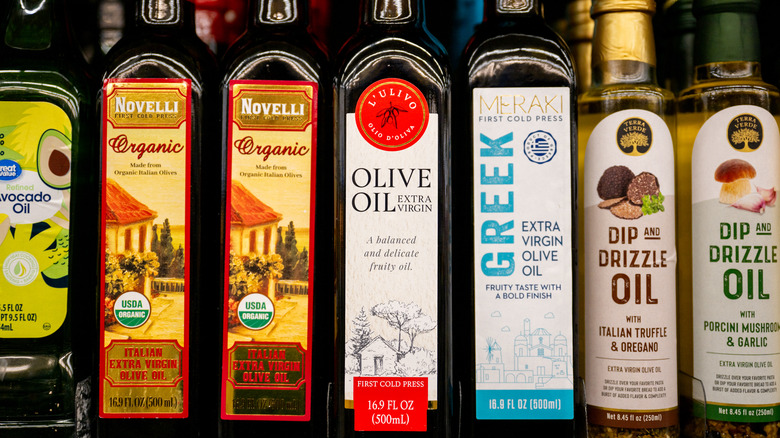 Close-up of various olive oil bottles on a shelf