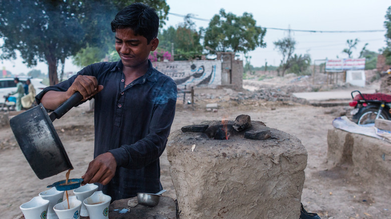 pouring tea from pot