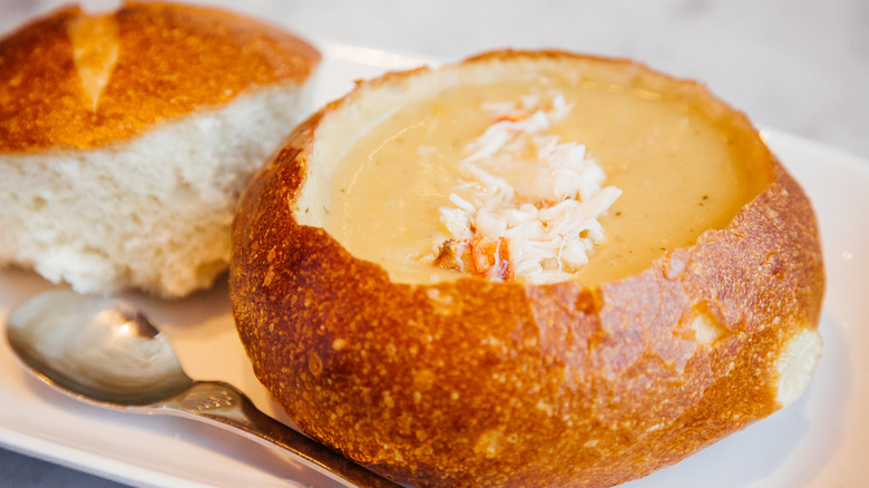 Sourdough bread bowl filled with creamy soup