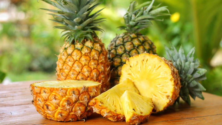 Sliced pineapples sitting on a table