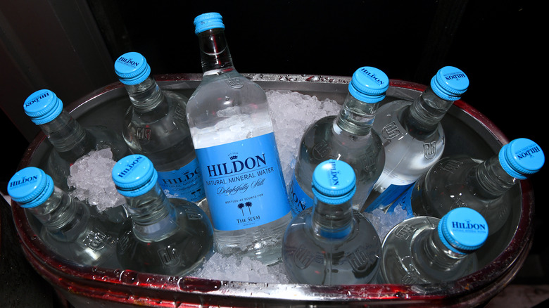 Bottles of Hildon Natural Mineral Water in ice bucket