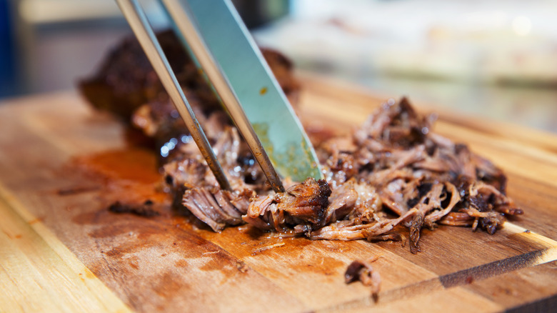 pulled pork being shredded