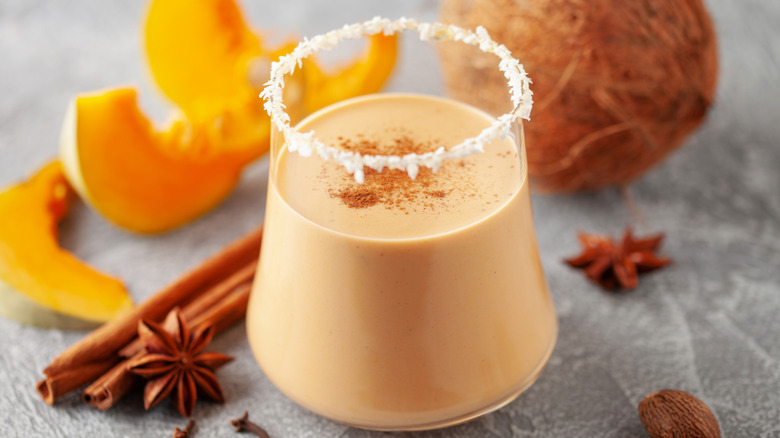 caramel pumpkin coquito with ingredients