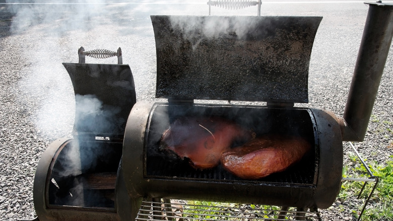 Barbecue smoker with ham and brisket cooking