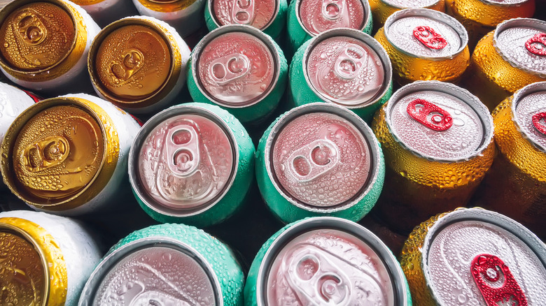 collection of ice cold canned drinks