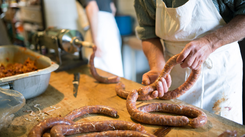 man making sausage 