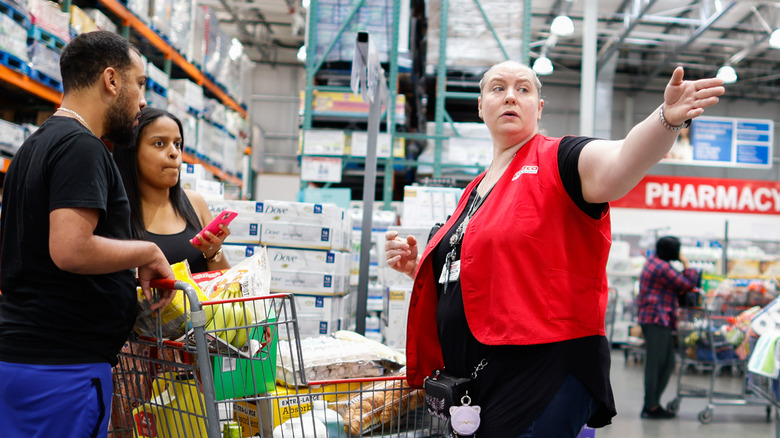 Costco staff helping shoppers