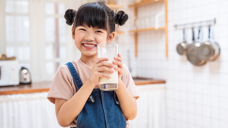 Child with a glass of milk