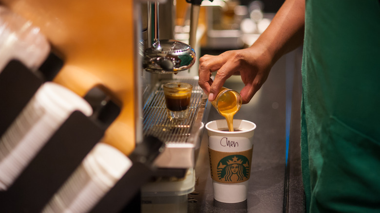 Starbucks barista makes drinks