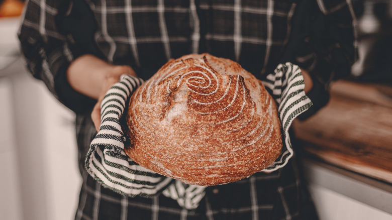 woman holding bread 