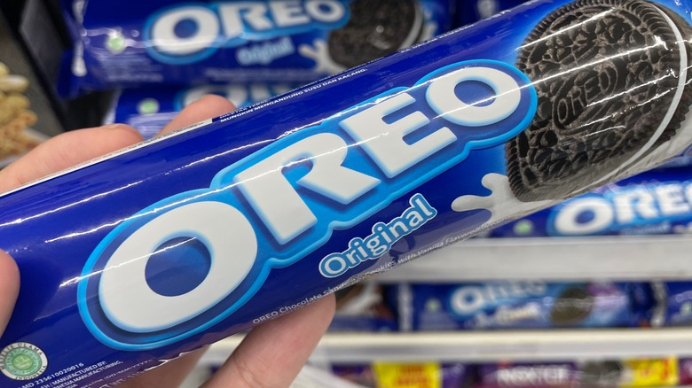 person holding oreo original package