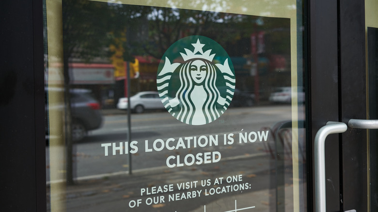 Closed sign in Starbucks window