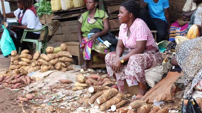 Selling yams at African market 