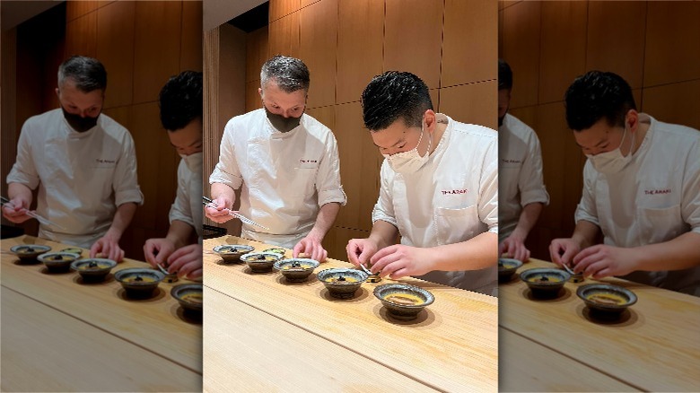 sushi chefs preparing dishes at Araki