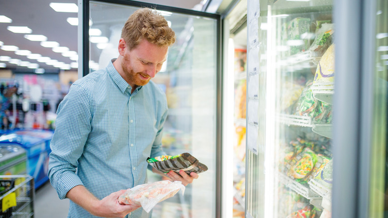 man in freezer aisle