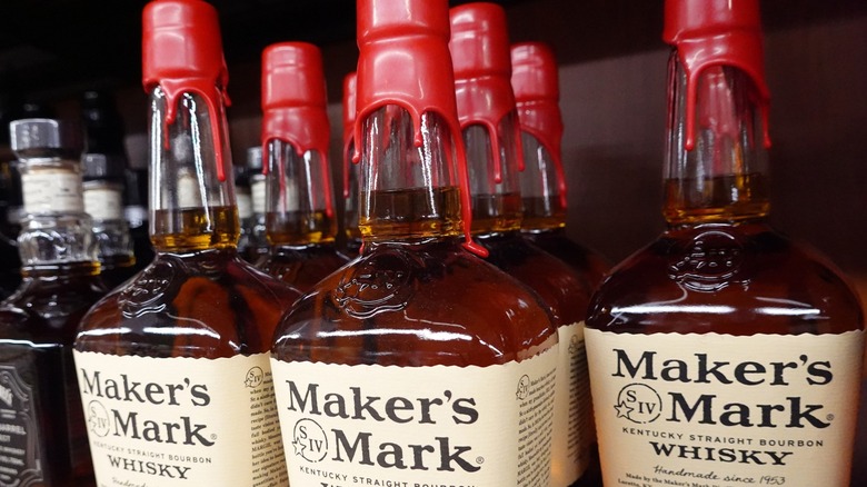 Several bottles of red wax-sealed Maker's Mark whisky