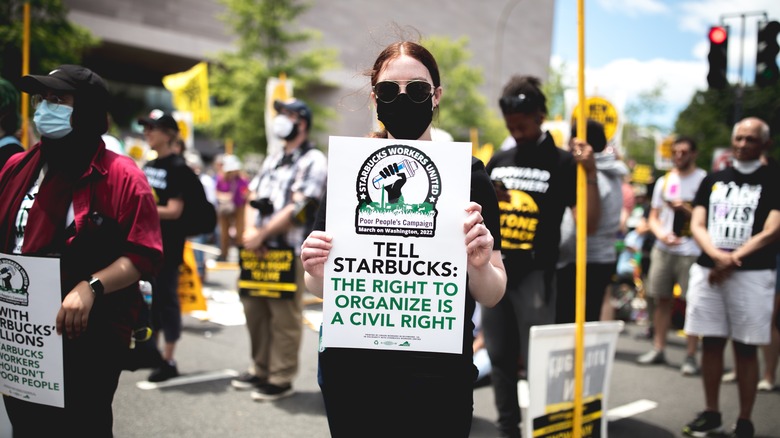 Starbucks pro-union advocate holding a sign