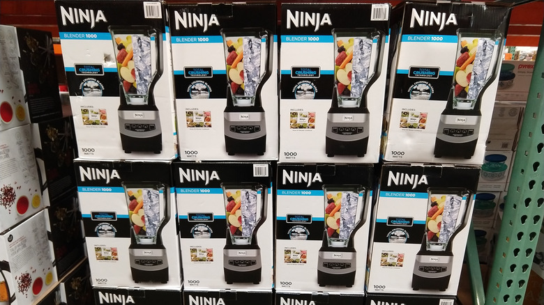 Ninja blenders stacked on shelf