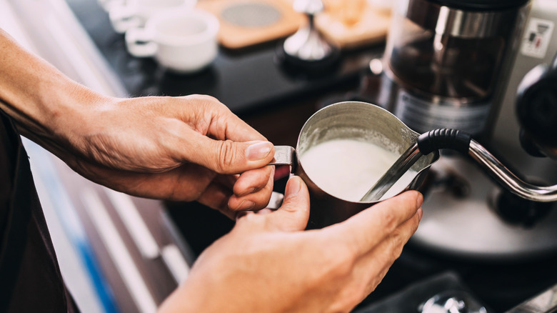 barista steaming milk