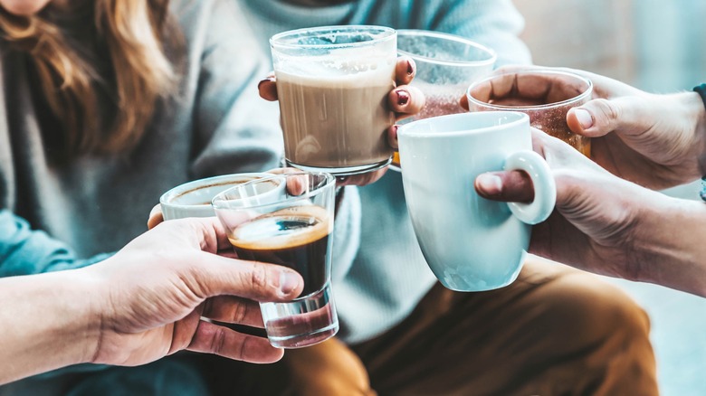 friends toasting with coffee