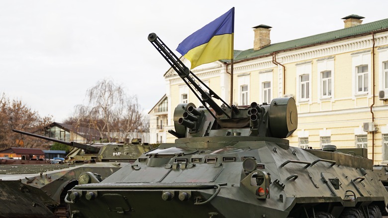 Ukrainian flag flies over military transport 