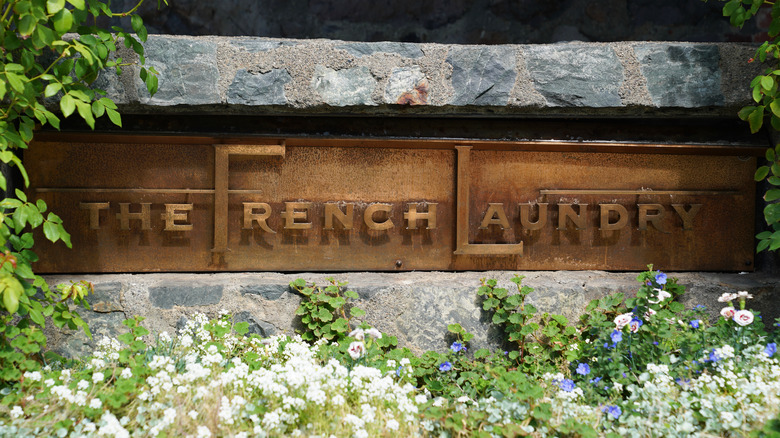 The French Laundry restaurant sign with flowers