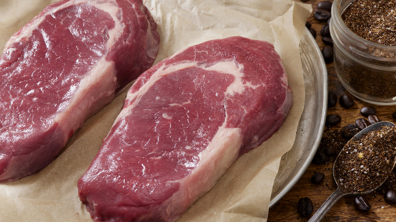 A pair of raw top sirloin steaks