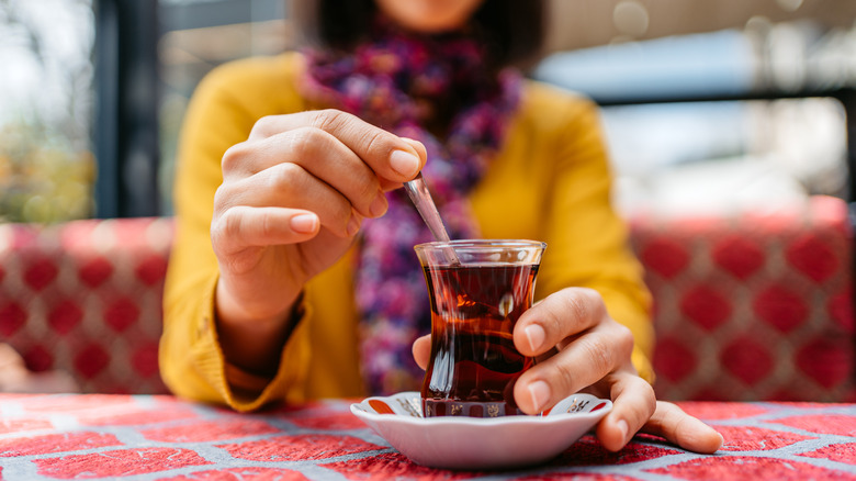 woman stirring Turkish tea