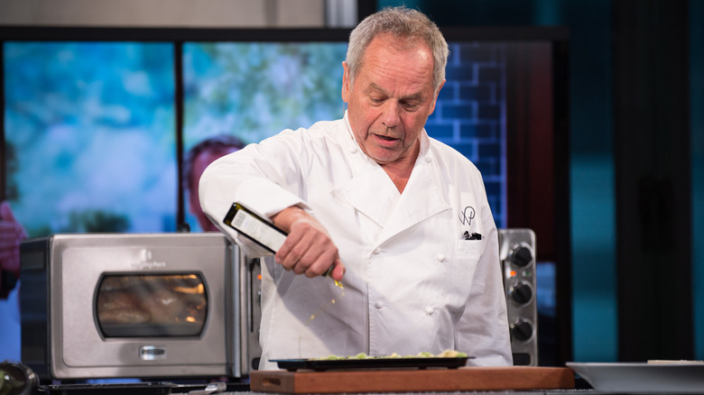 Wolfgang Puck cooking at event