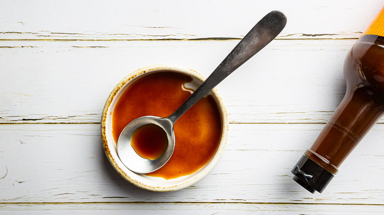 worcestershire sauce and metal spoon