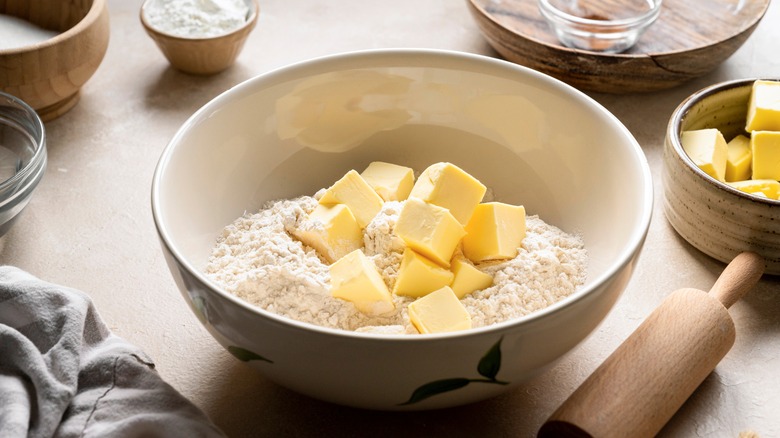 mixing dough with roller and butter