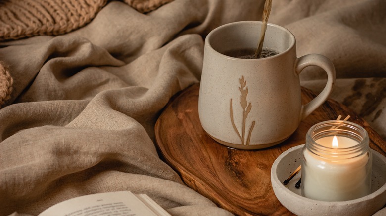 tea with candle and book